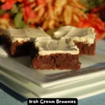 A plate of rich, chocolatey Irish Cream Brownies topped with toffee bits.