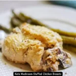 Delicious Keto Mushroom-Stuffed Chicken Breasts, perfectly baked and garnished with herbs.