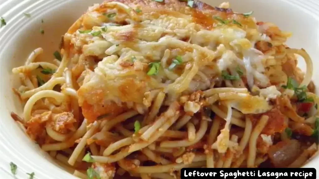 A plate of Leftover Spaghetti Lasagna with melted mozzarella cheese and fresh herbs.