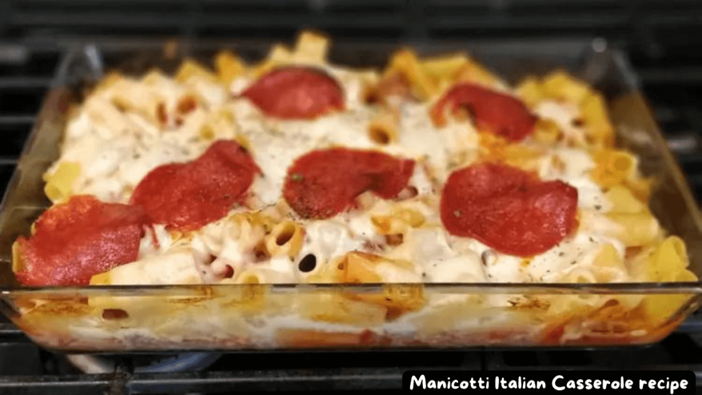 A freshly baked Manicotti Italian Casserole in a glass baking dish, topped with melted mozzarella cheese and pepperoni slices.