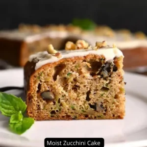 A slice of moist zucchini cake with cream cheese frosting