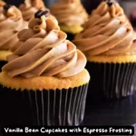 A batch of freshly baked vanilla bean cupcakes topped with silky espresso frosting.