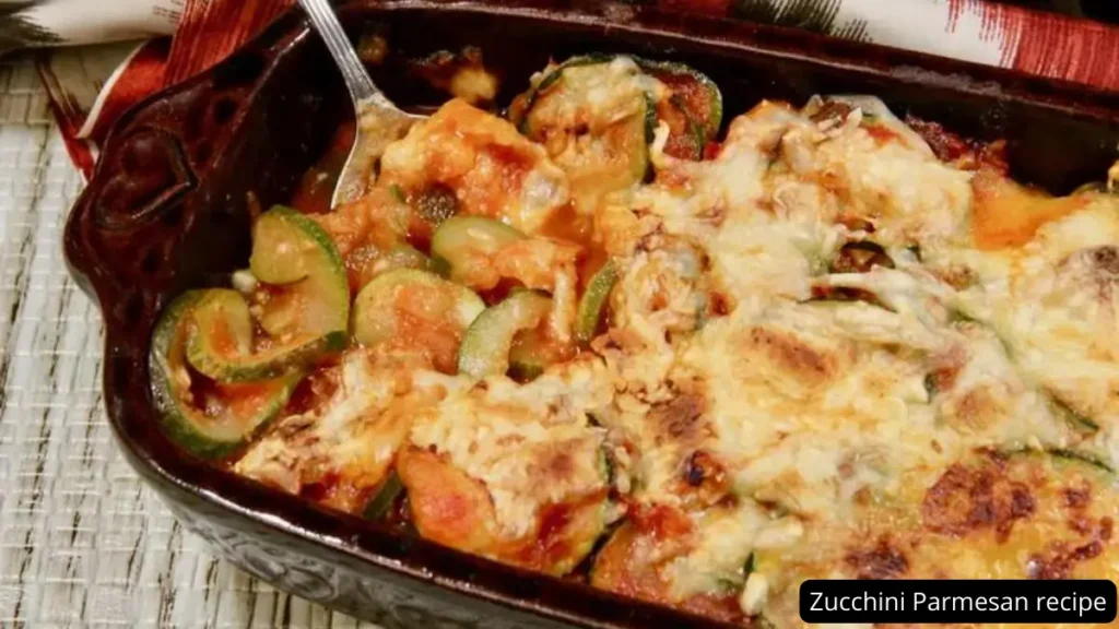 Baked Zucchini Parmesan with melted cheese in a dish