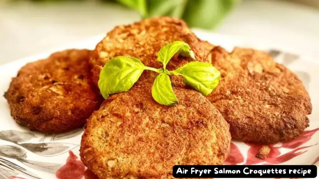 A plate of golden brown air fryer salmon croquettes, ready to be served.