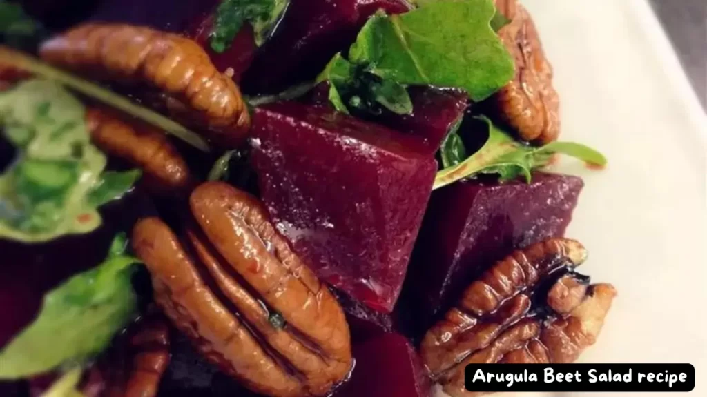 Close-up of a fresh arugula beet salad with pecans, ready to be served.