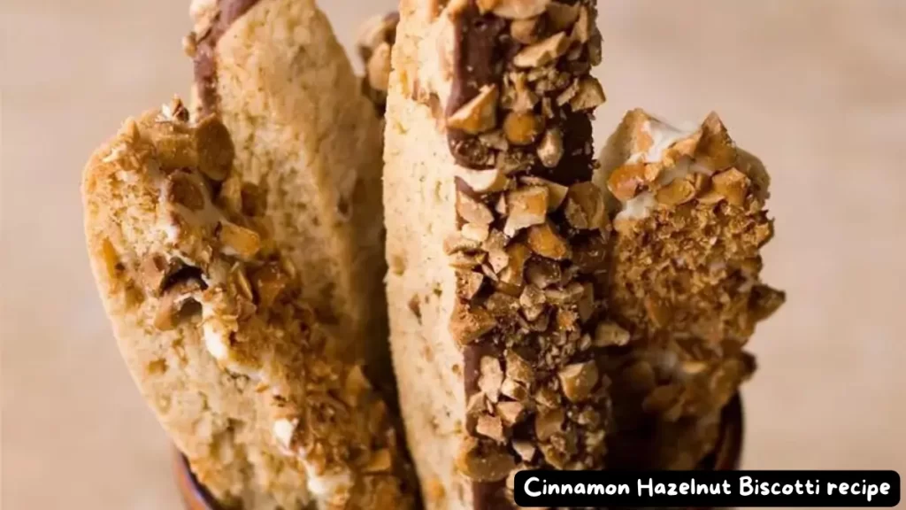 Close-up of cinnamon hazelnut biscotti with chopped hazelnuts on top.