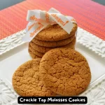 A batch of freshly baked Crackle Top Molasses Cookies with crackled tops.