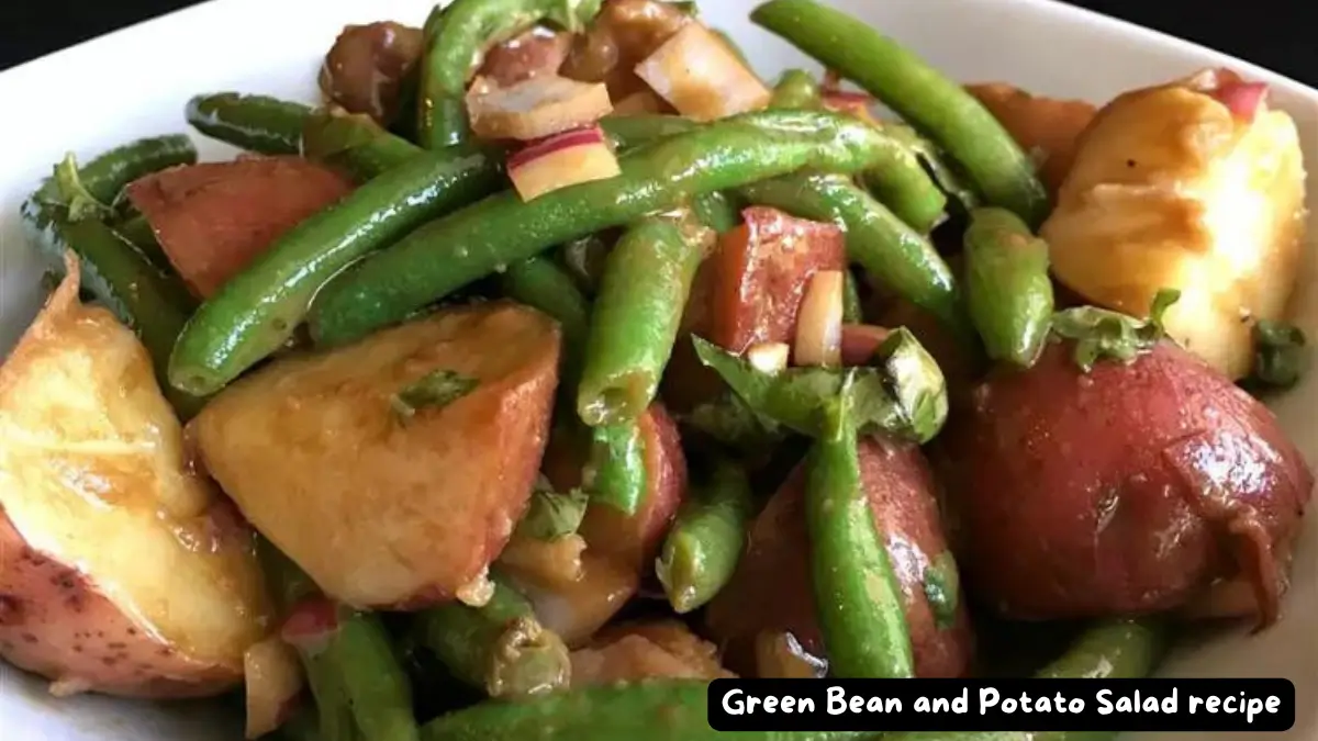 Bowl of Green Bean and Potato Salad with red potatoes, green beans, and red onion