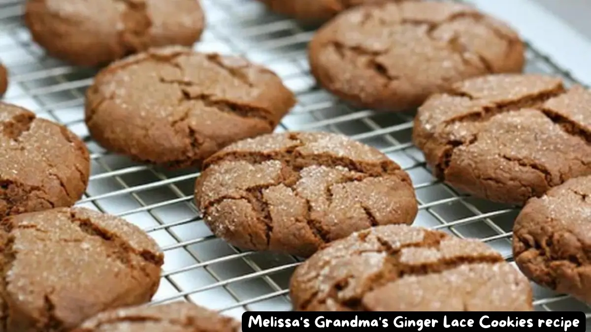 Close-up of Melissa's Grandma's Ginger Lace Cookies cooling on a wire rack, showcasing their crackled surface and sugar coating.