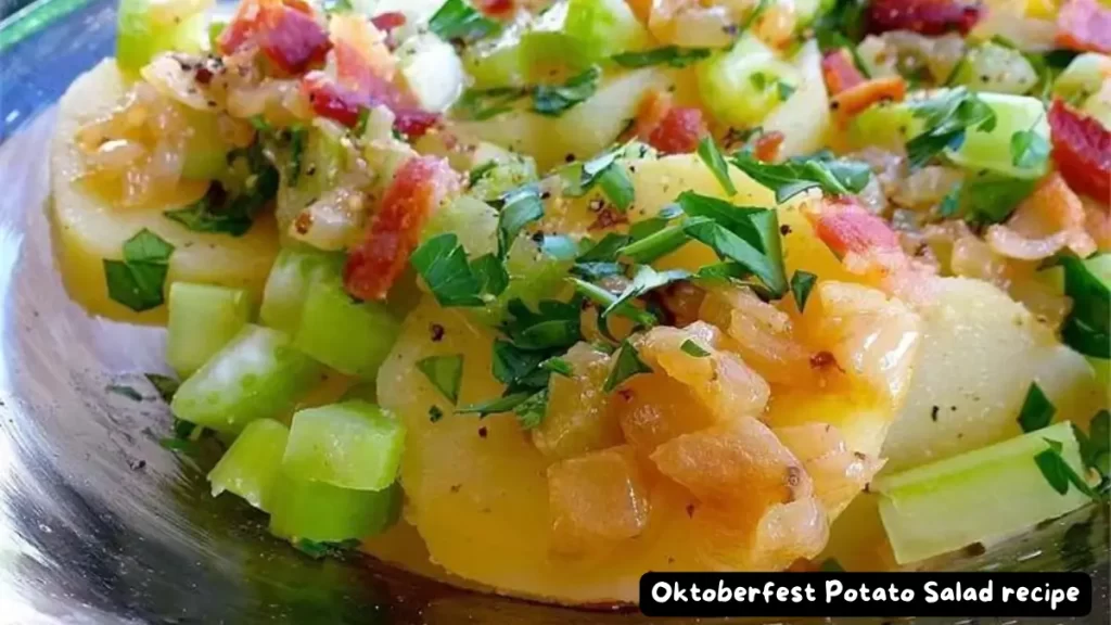 Close-up of a bowl of Oktoberfest Potato Salad with diced celery, onions, bacon, and parsley.