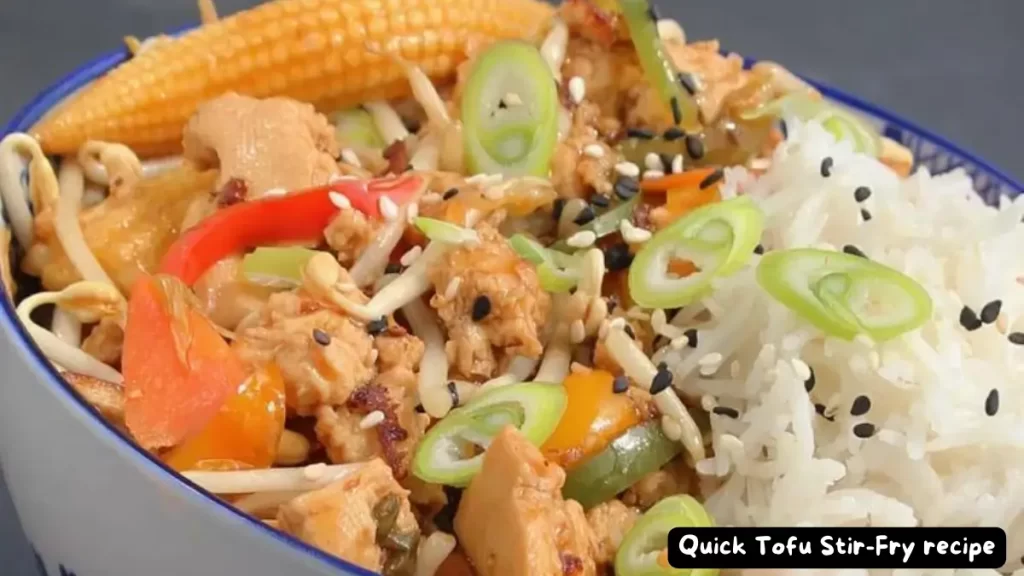A close-up shot of a colorful and vibrant quick tofu stir-fry served with rice