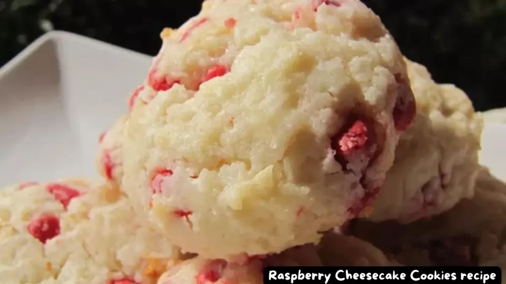Close-up view of Raspberry Cheesecake Cookies showcasing their soft, creamy texture and vibrant raspberry bits.