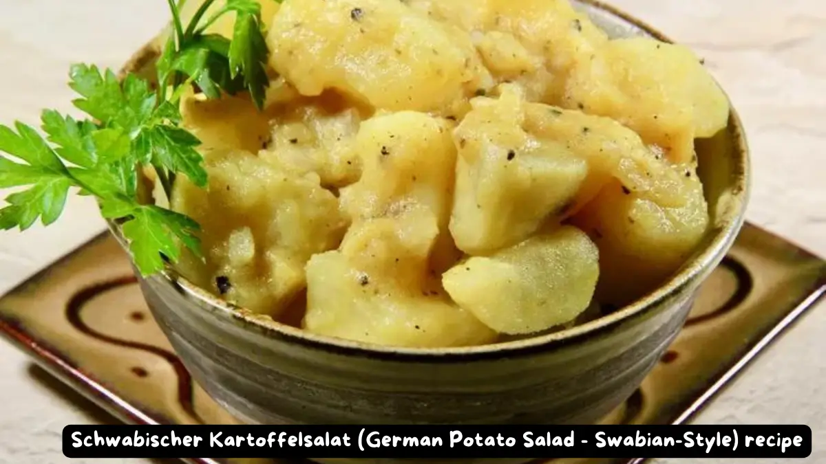 A bowl of Schwabischer Kartoffelsalat (German Potato Salad Swabian-Style) garnished with parsley.