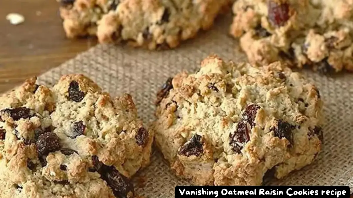 Close-up of vanishing oatmeal raisin cookies on a burlap surface.