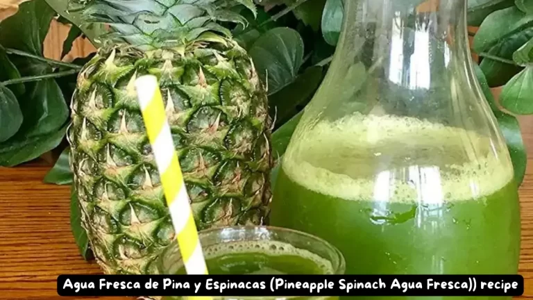 A close-up of a glass filled with Pineapple Spinach Agua Fresca, garnished with a yellow striped straw, next to a whole pineapple.