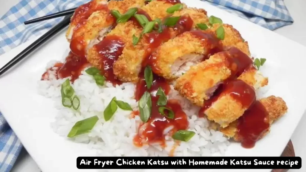 A delicious plate of crispy air fryer chicken katsu, garnished with fresh green onions, served with a side of homemade katsu sauce over white rice.