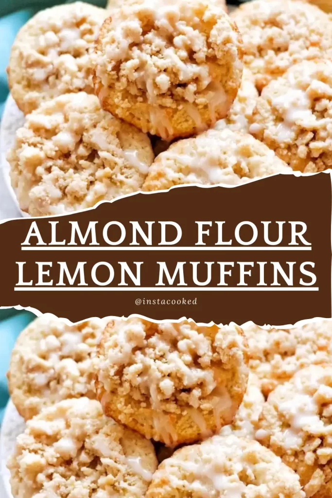 A plate of Almond Flour Lemon Muffins topped with a golden crumble and a drizzle of lemon glaze.