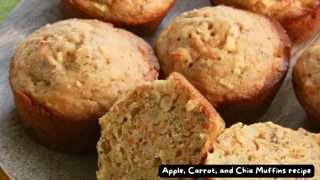 Close-up of freshly baked apple, carrot, and chia muffins on a plate.