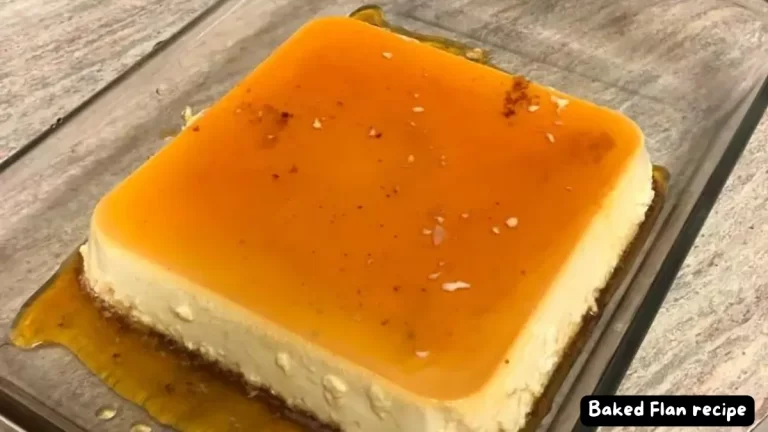 A square-shaped baked flan with a smooth golden caramel top, served in a glass dish.