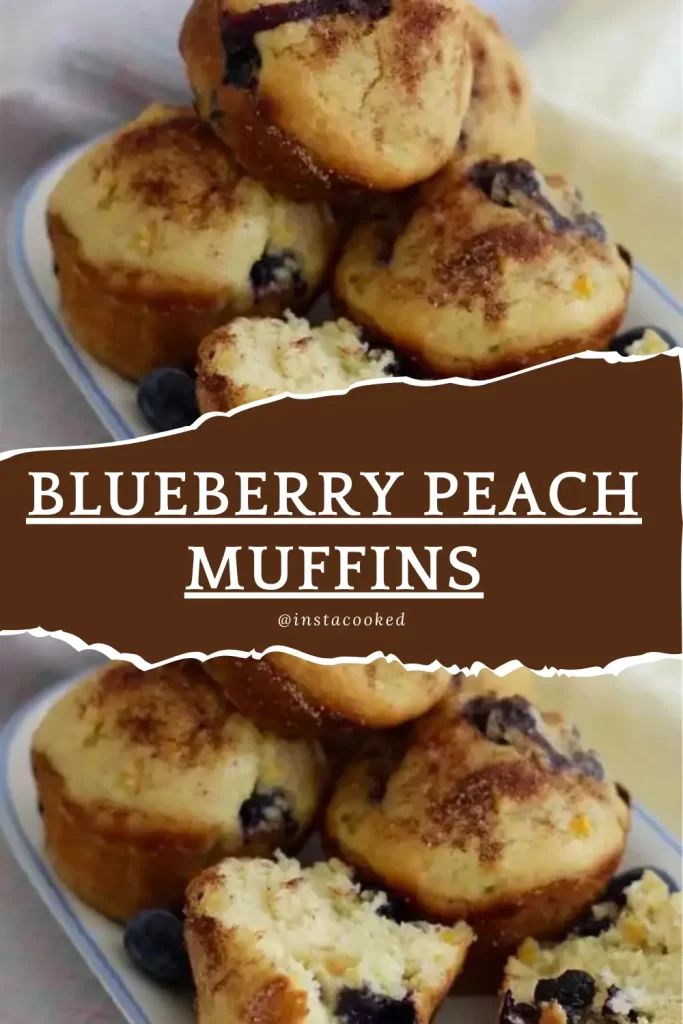 A tray of blueberry peach muffins, with one muffin cut open to reveal the juicy blueberries and peach chunks inside.