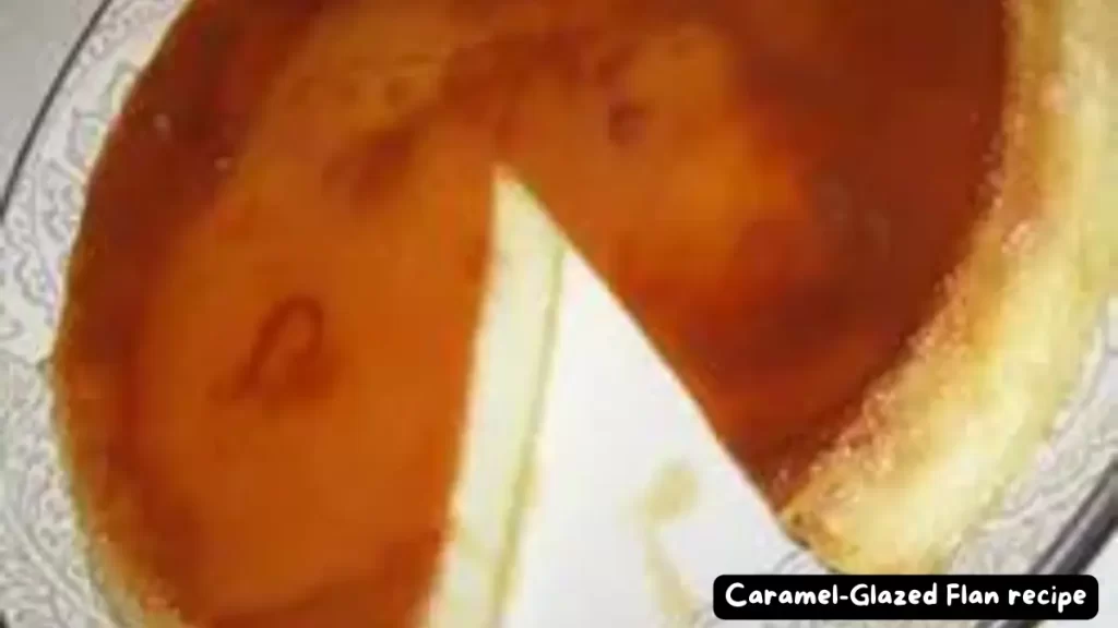 A caramel-glazed flan with a slice removed, showing the smooth, creamy texture of the dessert.
