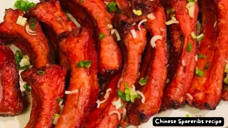 A plate of mouth-watering Chinese spareribs garnished with green onions.