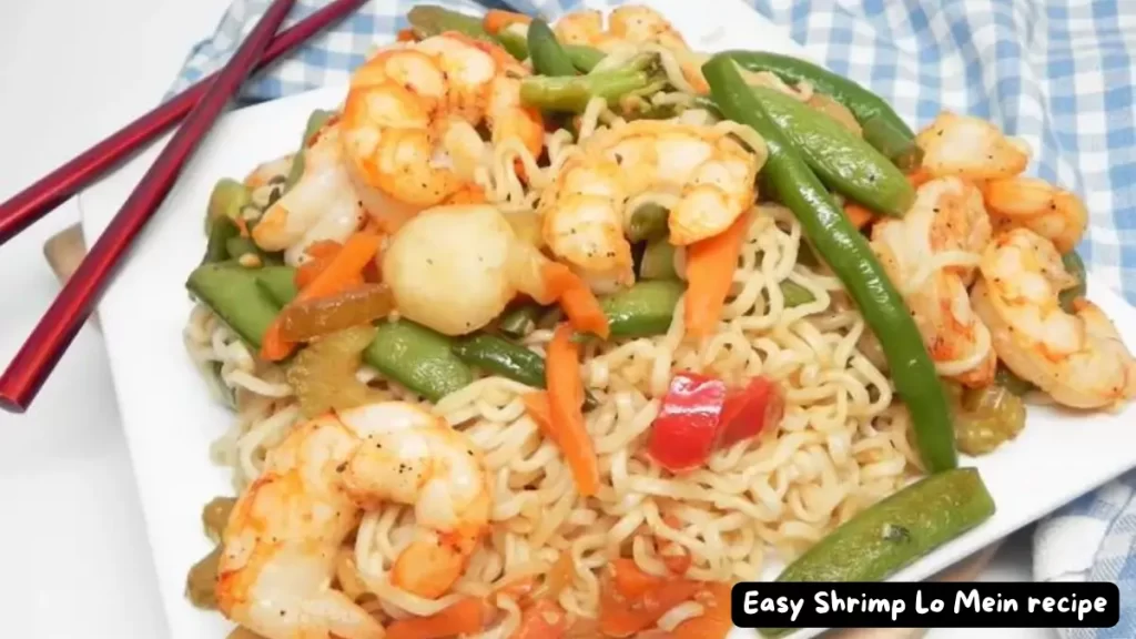 A plate of Easy Shrimp Lo Mein with shrimp, mixed vegetables, and ramen noodles.