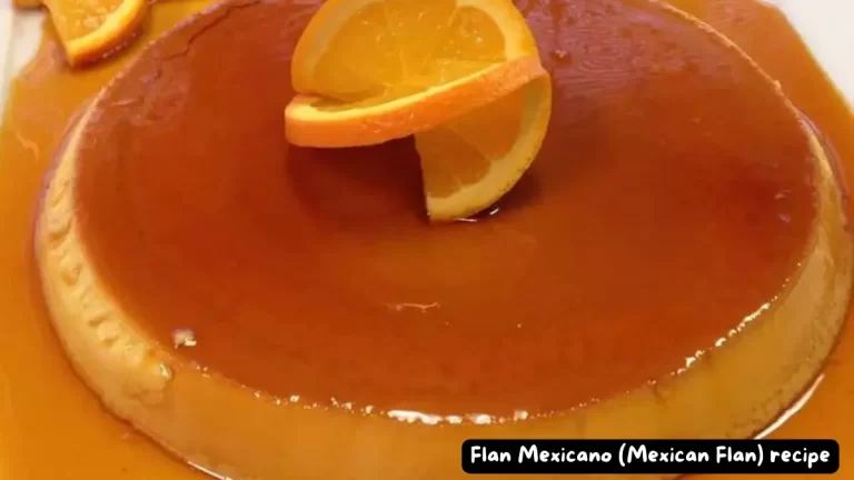 A beautifully presented Mexican flan topped with orange slices and drizzled with rich caramel sauce.