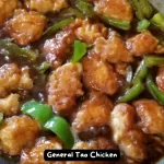 A plate of homemade General Tao Chicken served with steamed rice