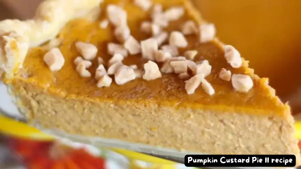 A close-up of a slice of pumpkin custard pie garnished with chopped candied ginger pieces.