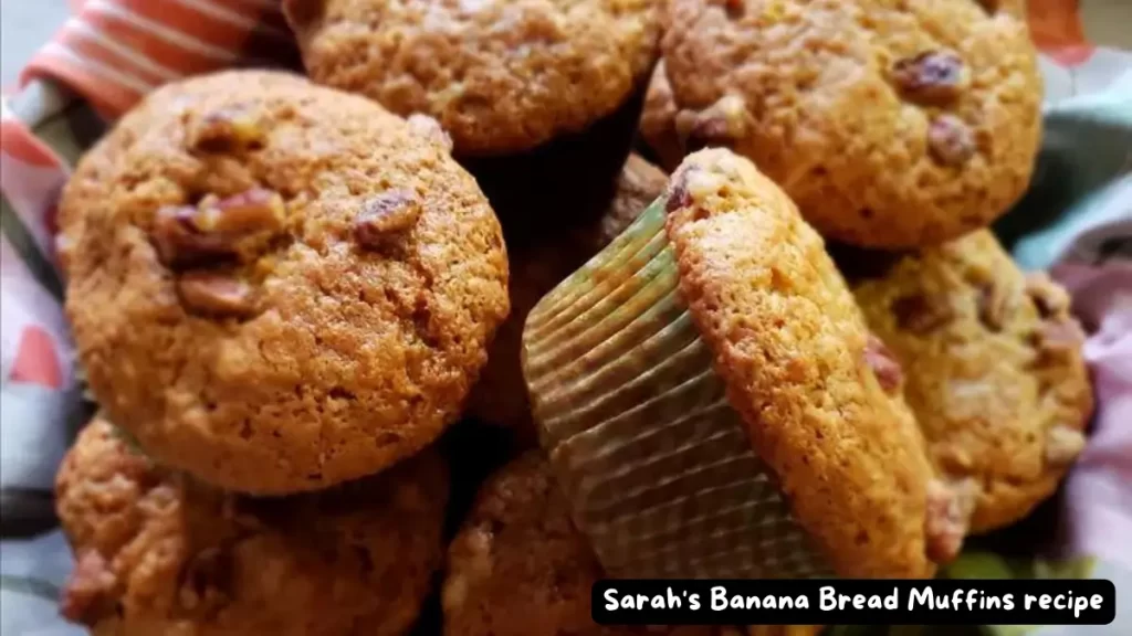 A basket filled with freshly baked Sarah's Banana Bread Muffins, showcasing their golden-brown crust and nutty texture.