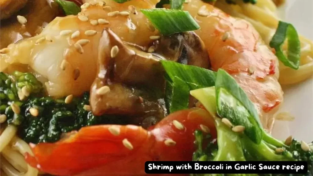 A close-up of a plate of shrimp with broccoli in garlic sauce, garnished with green onions and sesame seeds.
