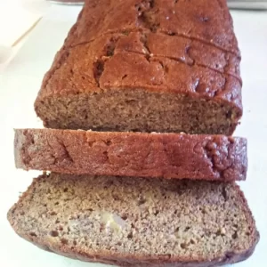 Freshly baked loaf of classic banana bread on a cooling rack